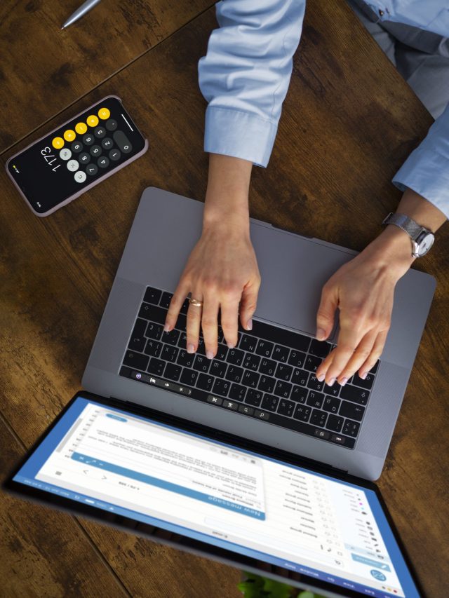 view-woman-typing-laptop